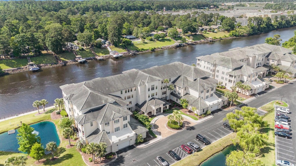 Aerial perspective of suburban area with a large body of water