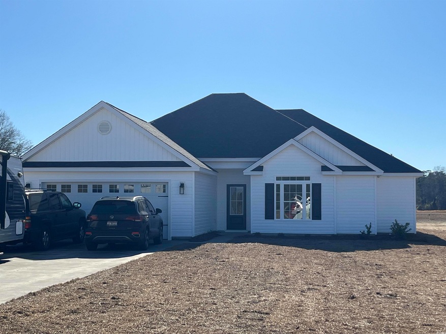 Single story home featuring a garage