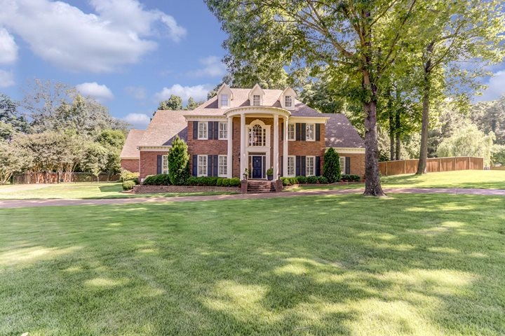 This stately 4 bedroom, 3.5 bath brick home in Dog