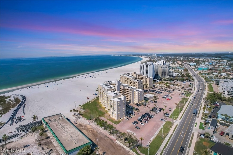 Aerial view at dusk with a beach and water view
