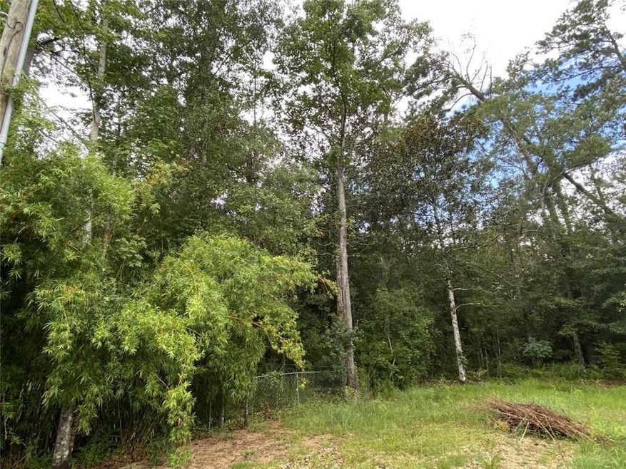 Lot starts to the right of fence.
