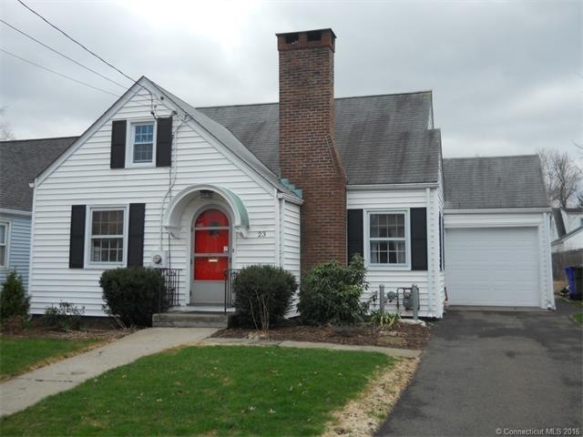 English type cape with attached garage and fenced 