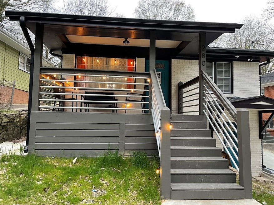 View of exterior entry with brick siding