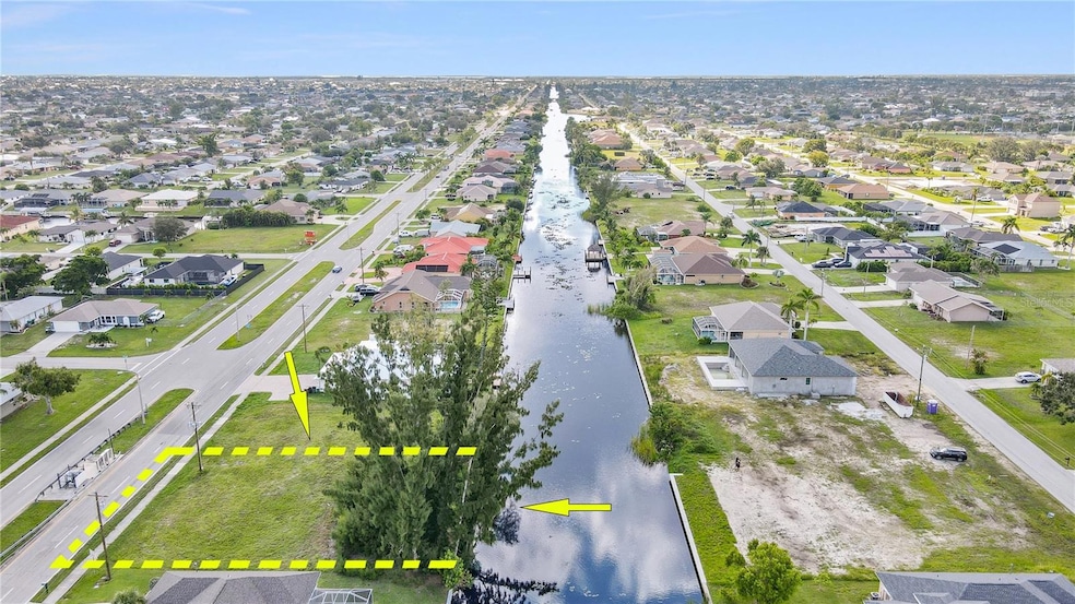 Build your Custom WATERFRONT DREAM HOME on this Gorgeous, Buildable CANAL FRONT Vacant Lot on Balentine Canal in the Heart of the Highly-Sought-After Cape Coral PELICAN District! HOLY COW!