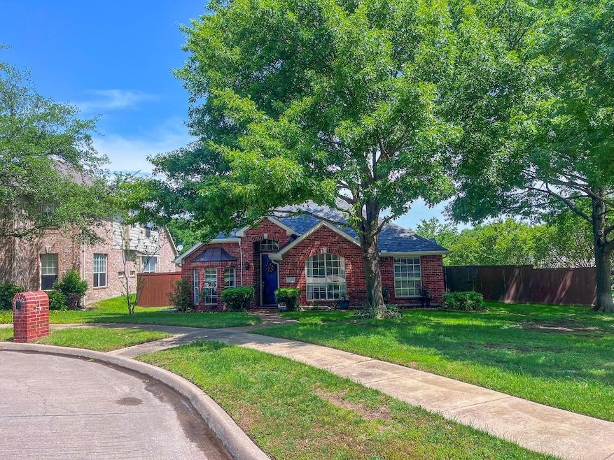 View of front of home with fence, a front lawn, an