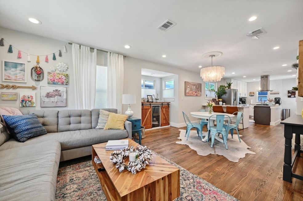 Living area with a chandelier, recessed lighting,