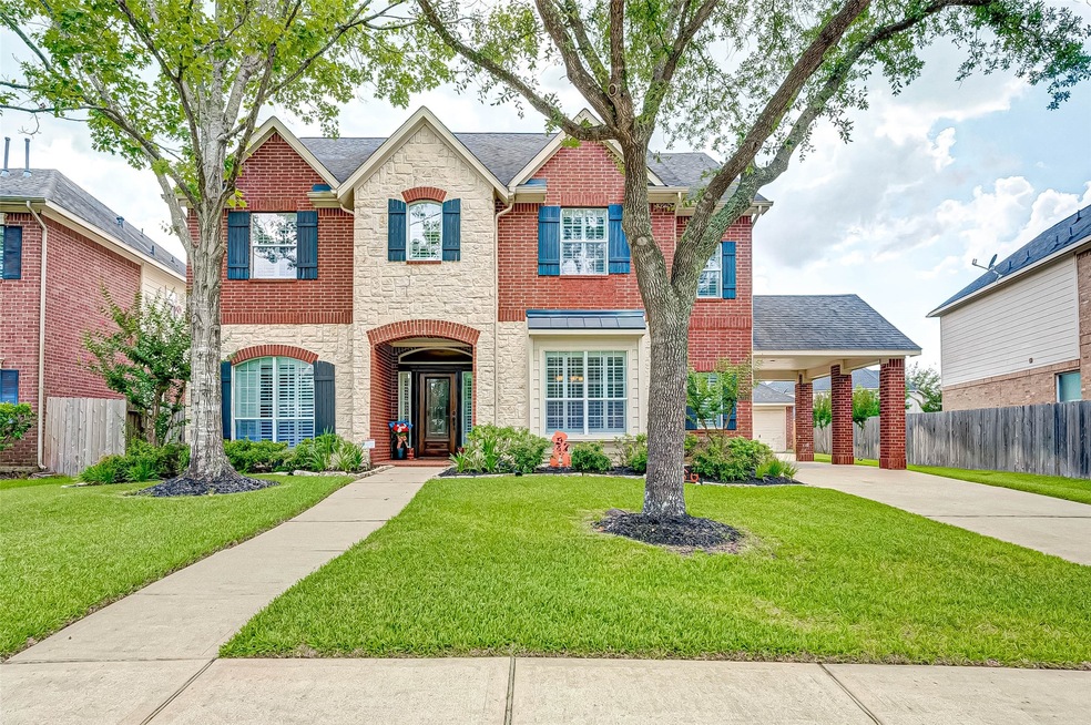 Gorgeous brick and stone complement each other on this incredible home.
