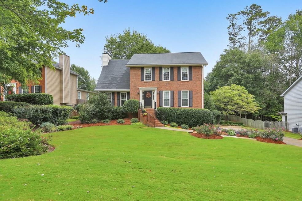 Stunning professionally landscaped brick front hom