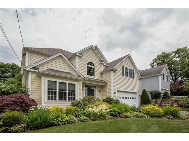 Front with lovely plantings, professionally landsc