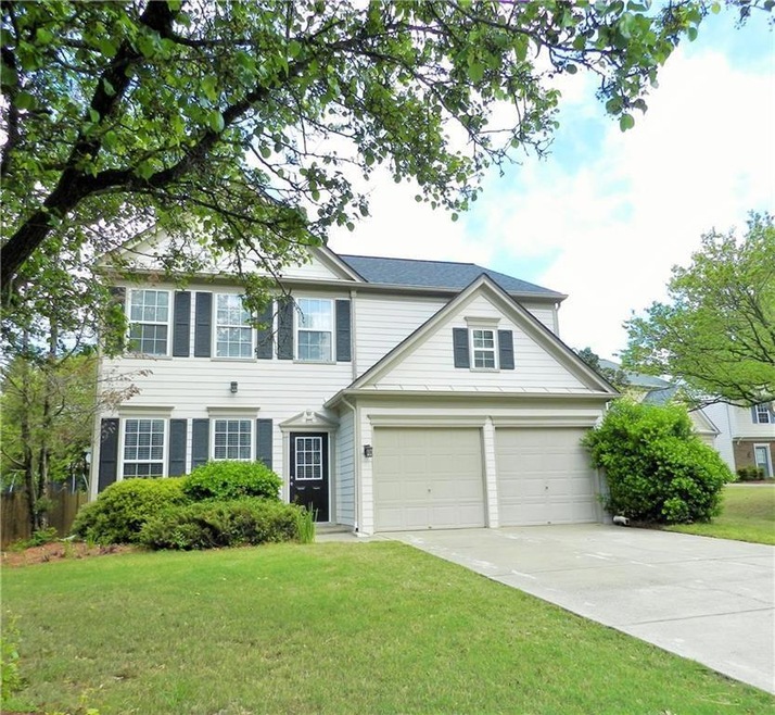 View of front of property with a garage and a fron