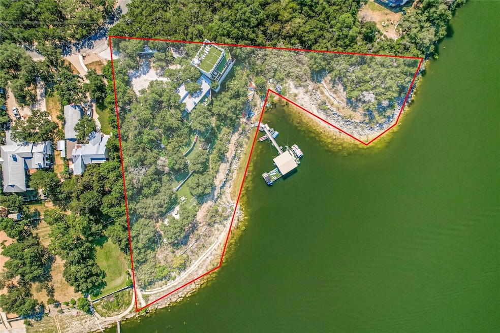 Aerial view of property and surrounding area with property parcel outlined