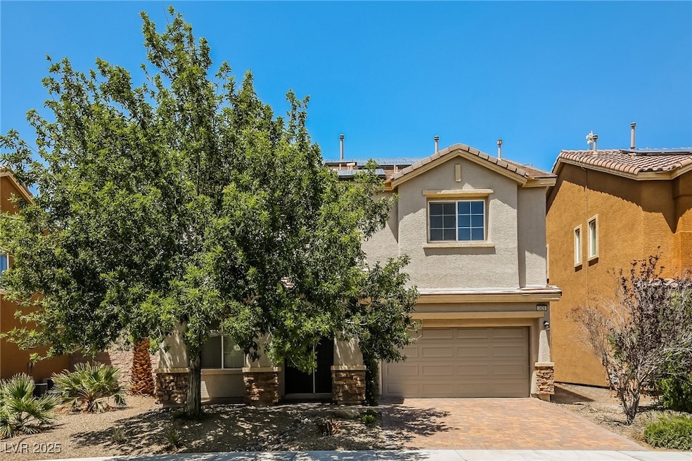 View of front of house featuring stucco siding, a