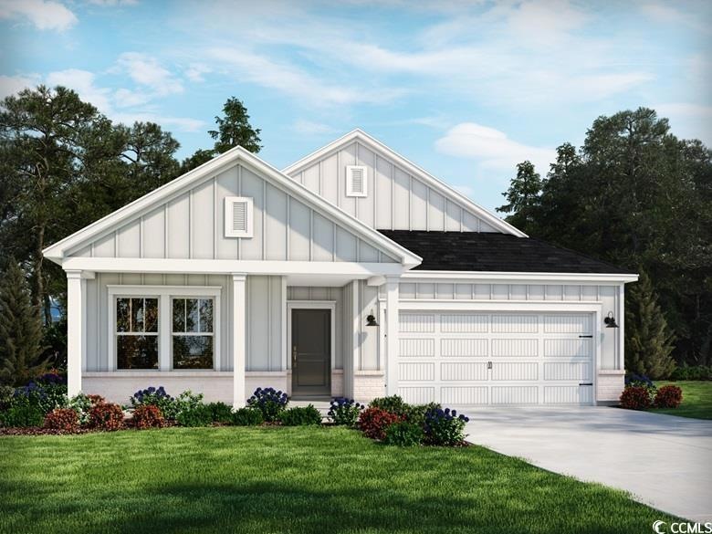 Modern farmhouse with a garage, concrete driveway,