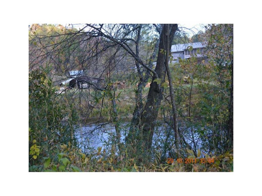 Exterior Front. 100 Feet of RIVER FRONTAGE