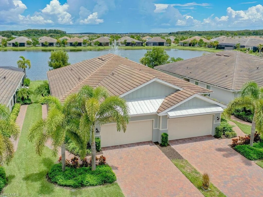 Front aerial view with lake in the background