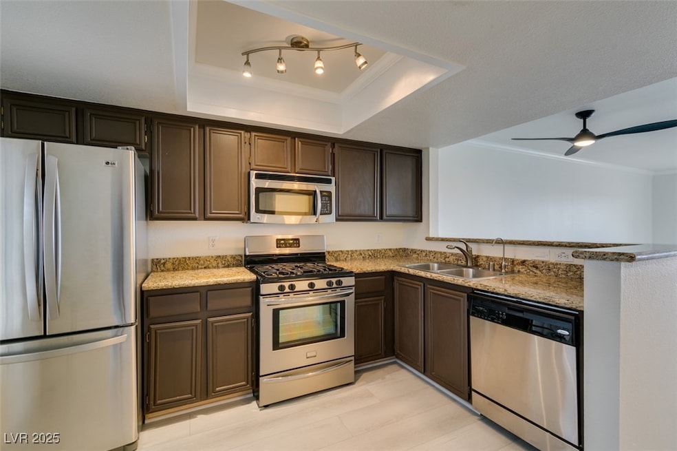 Kitchen featuring stainless steel appliances, a ra