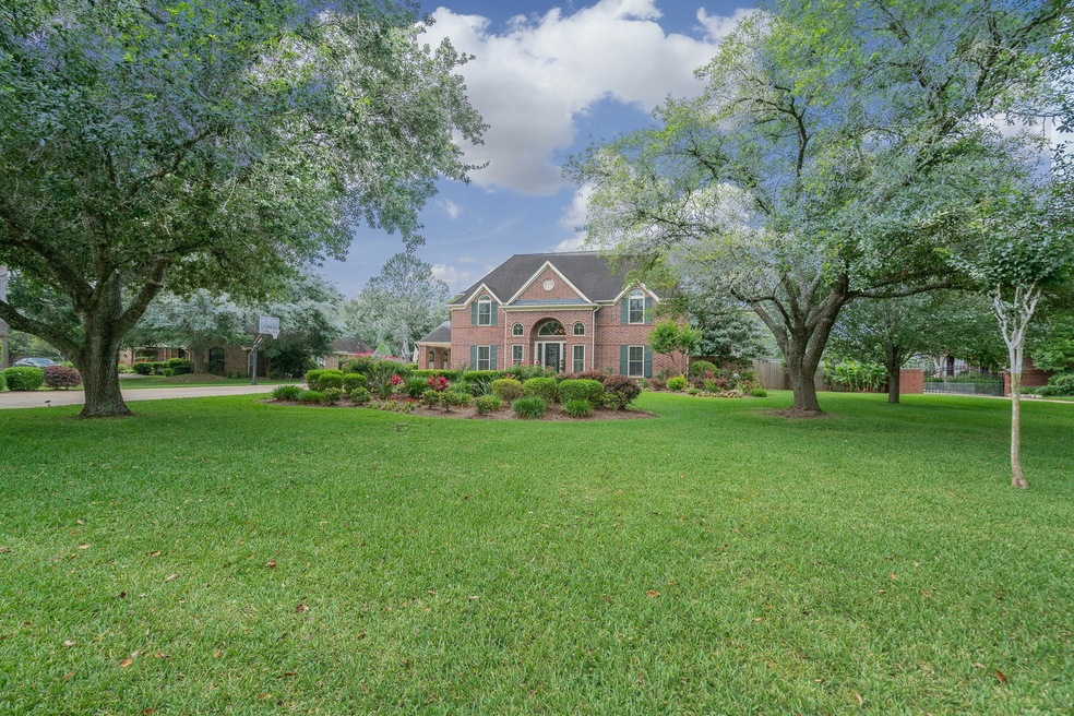 Situated on a stunning 0.63 acre lot adorned with sprawling oak trees and perfectly manicured landscaping, this home is located in the Coward Creek community - one of the most desirable and established neighborhoods in all of Friendswood!