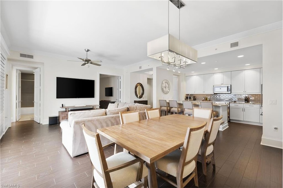 Dining space featuring visible vents, ceiling fan 