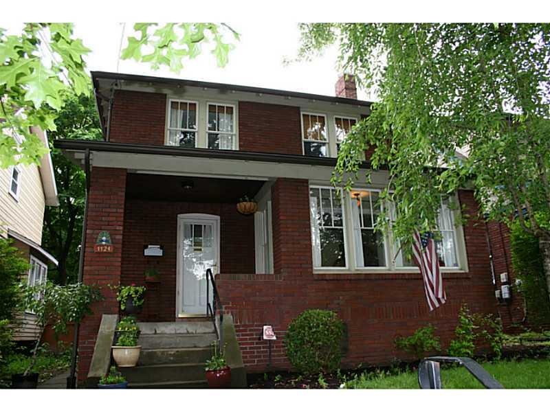 Exterior Front. Brick Home on Tree Lined Street in