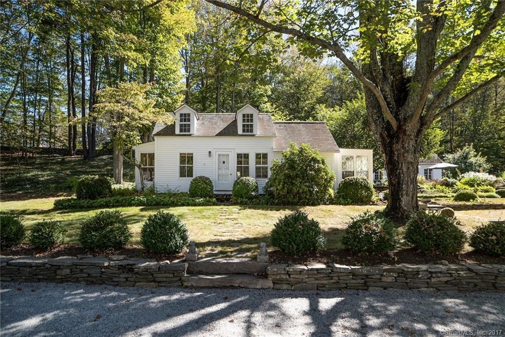 FRONT VIEW OF THE HOUSE AND PARTIAL VIEW OF THE TH