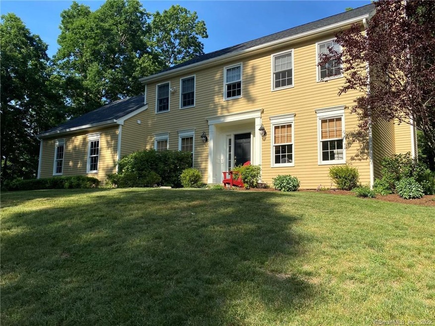 Afternoon sun shines on this beautiful colonial!