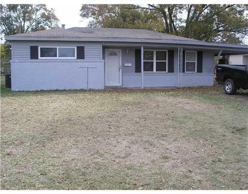 Exterior Front. Brick, newer vinyl siding and wind