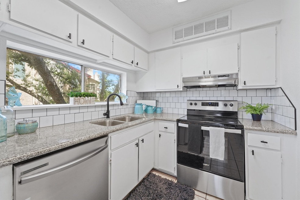 Kitchen features new granite counters and backspla