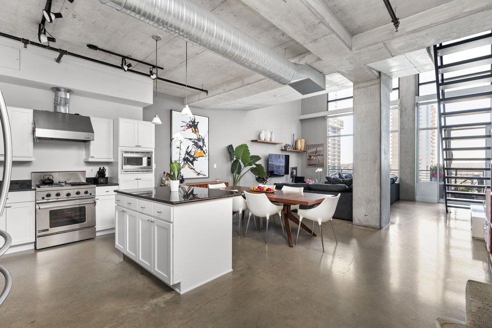 Kitchen with stainless steel appliances, ventilat