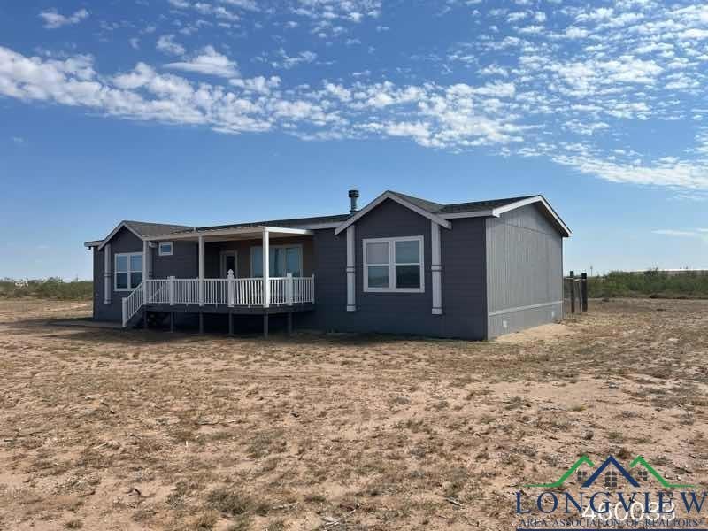 Rear view of house with a deck