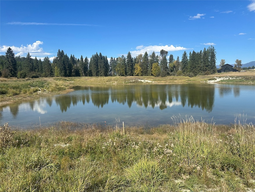 This lot borders the majority of the pond.