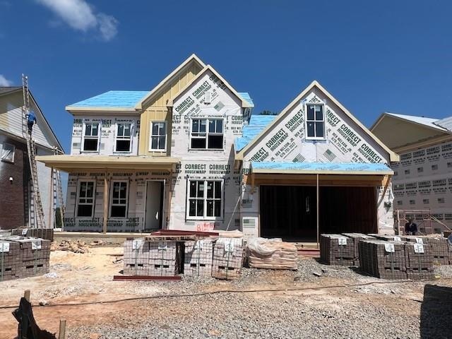 Unfinished property featuring covered porch