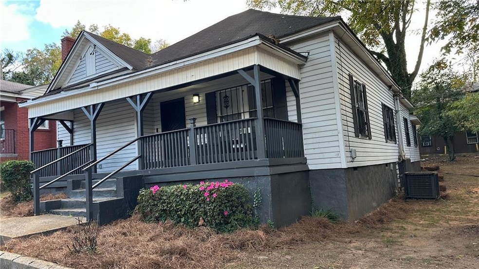 View of front facade featuring central AC unit and