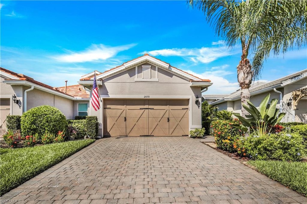 Beautiful native landscaping and paver driveway.