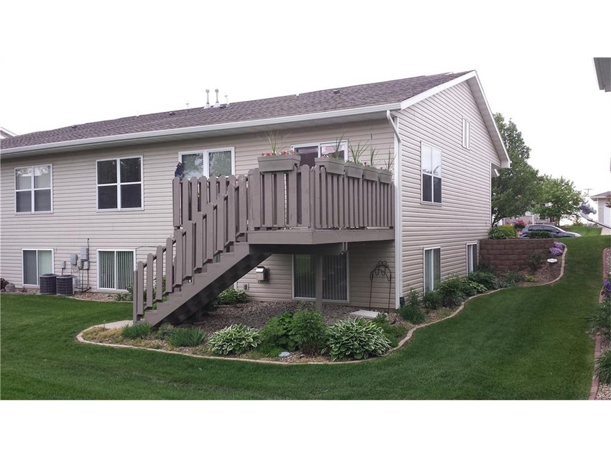 Exterior rear. Lovely deck, gardens.
