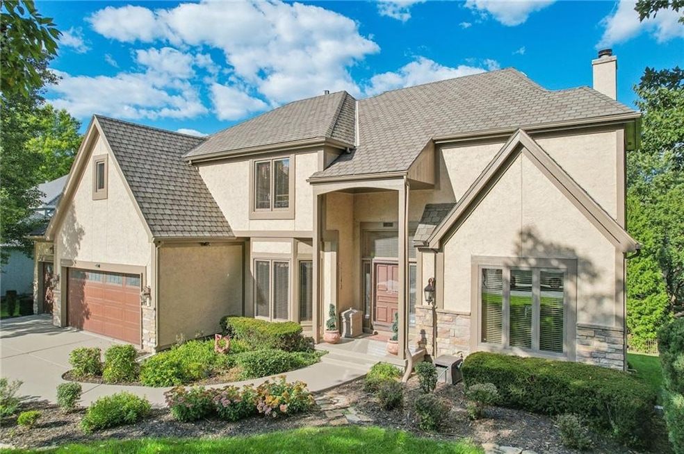 French country style house featuring a garage