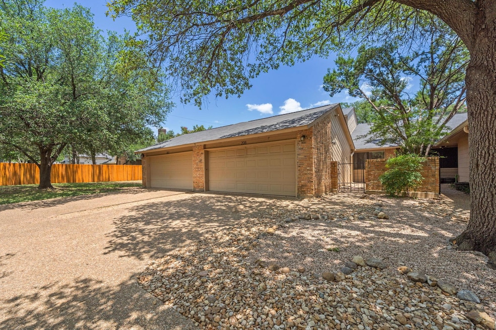 View of front of home featuring brick siding, a d