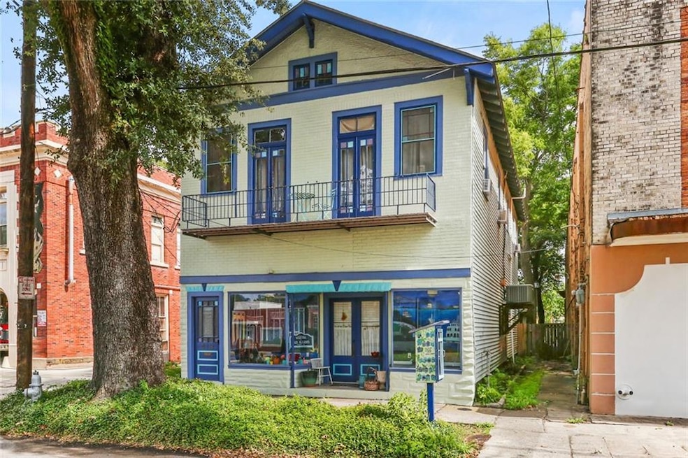 Upstairs front apartment with private balcony