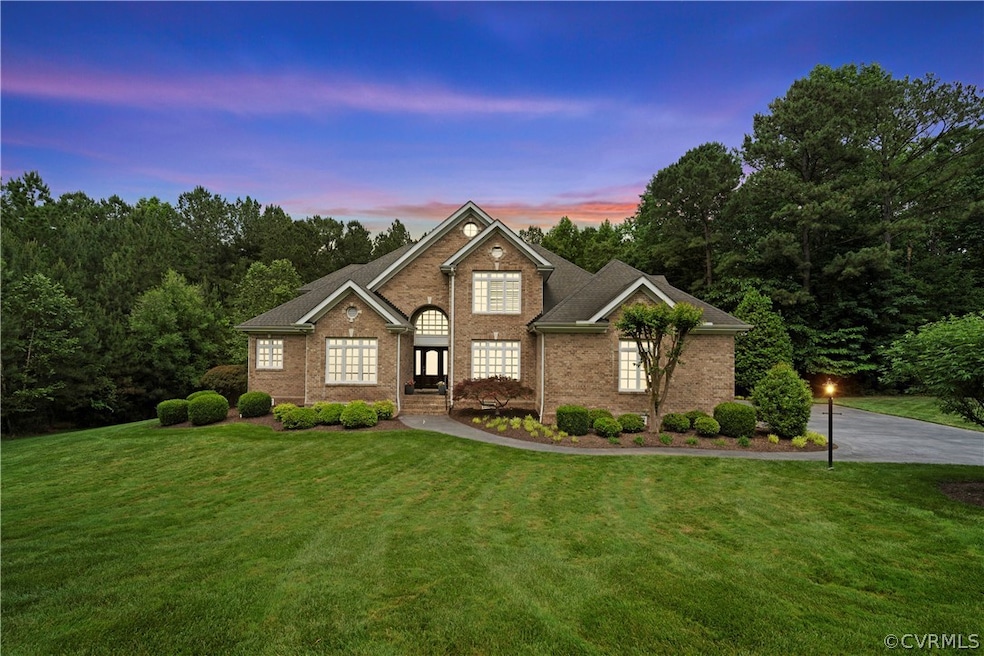 View of front of property featuring a yard