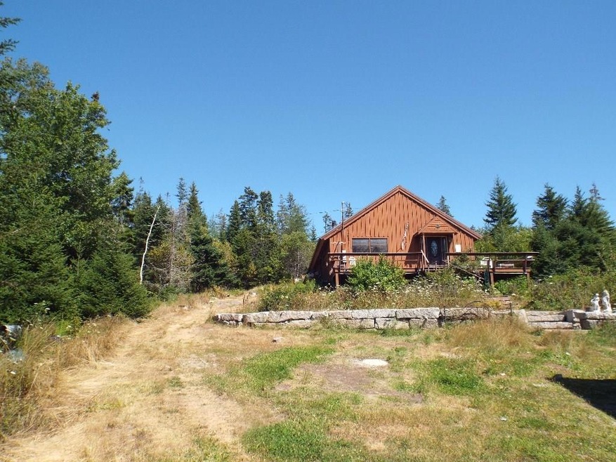 Ranch has a large porch and sets on...