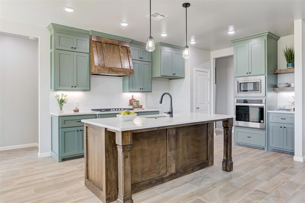 Designer kitchen with large island and coffee bar