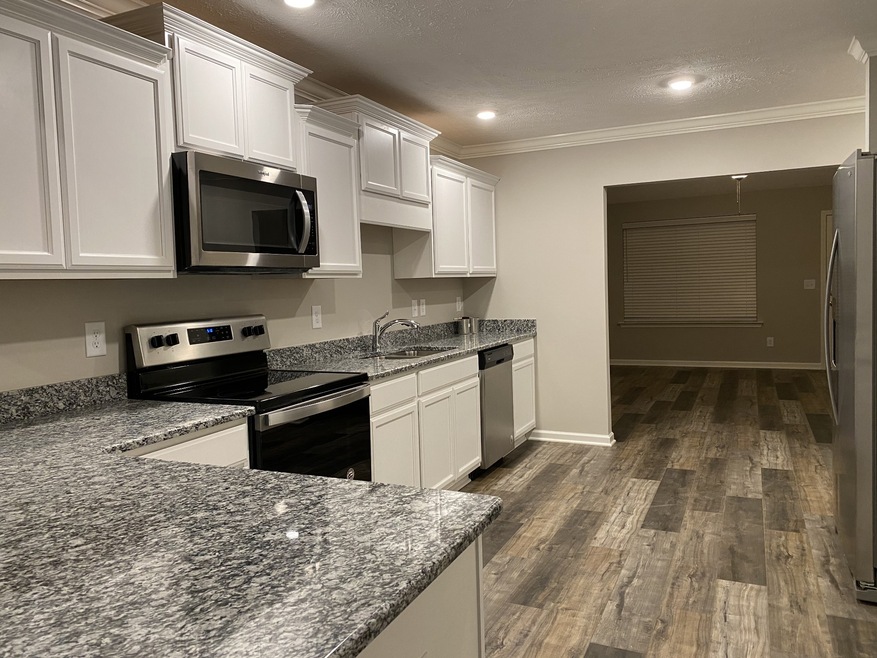 Kitchen has all appliances upgraded cabinets flooring and granite counter tops File photo