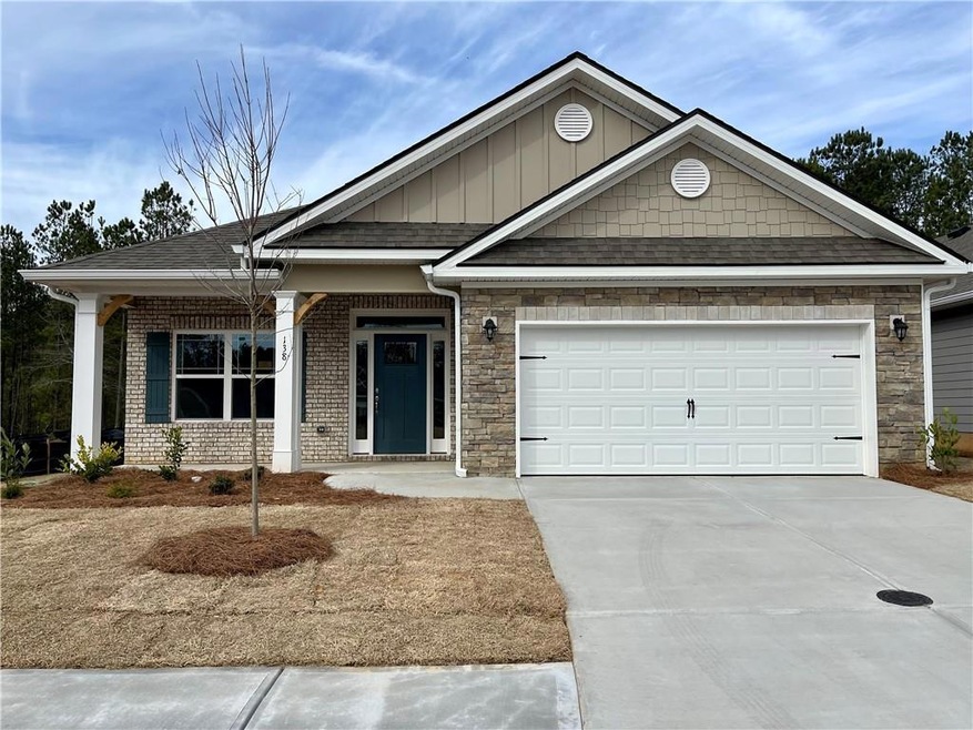 Craftsman house featuring a garage