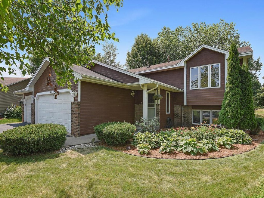 This home has a covered entry and attractive peren
