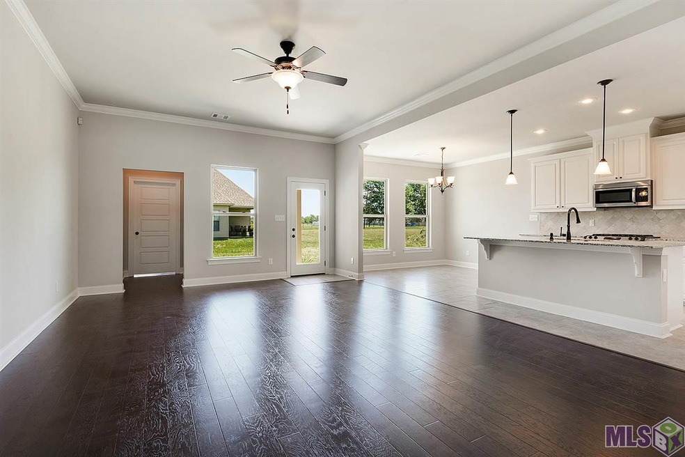 Open living, dining and kitchen.