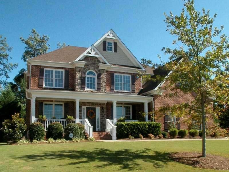 Exterior Front. 3-sided brick beauty on level and 