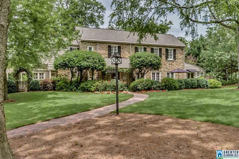 One of a kind stone home with established landscap