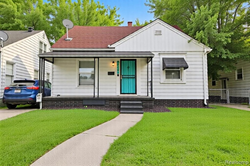 Bungalow with a front yard, a porch, and a shingled roof