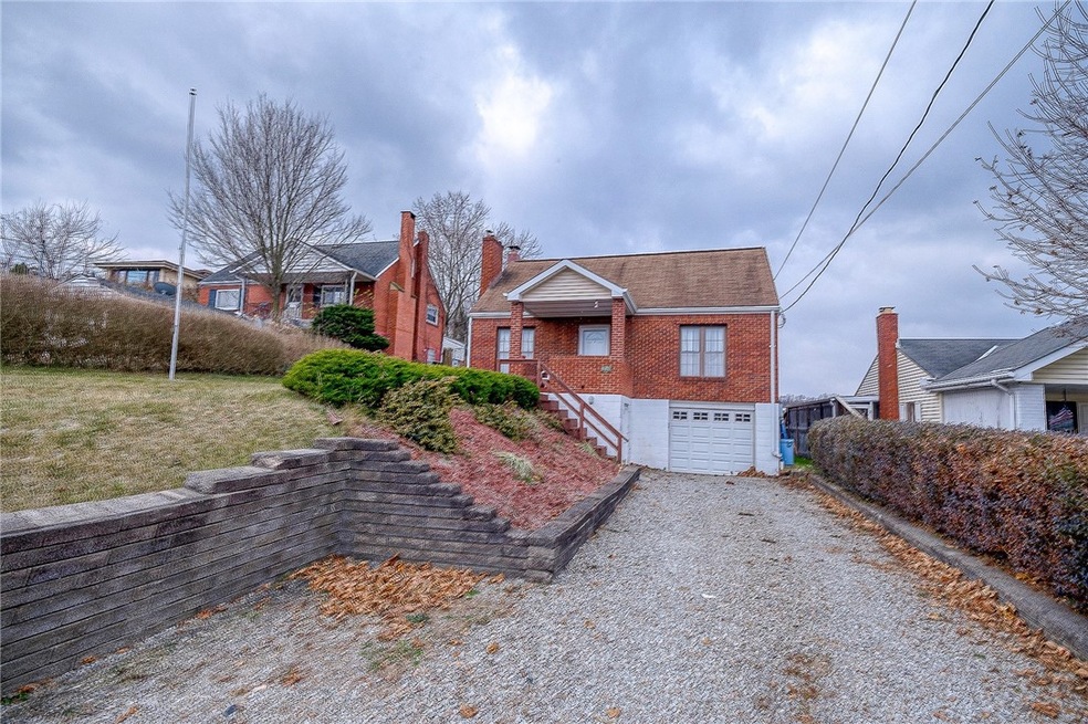 Front of home showing off set parking space so no