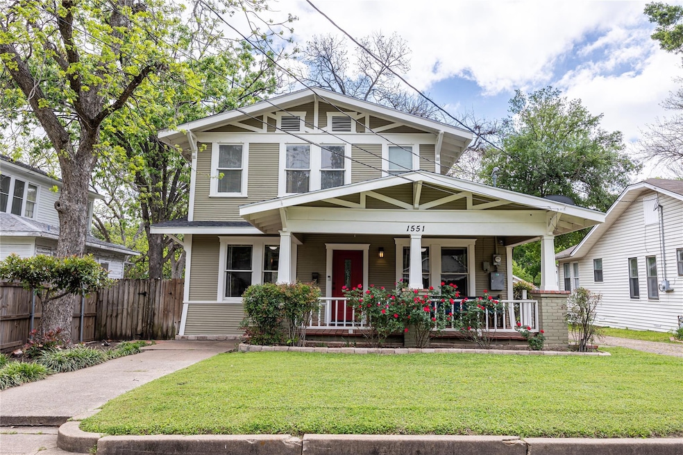 View of front of house with a front lawn and a porch
