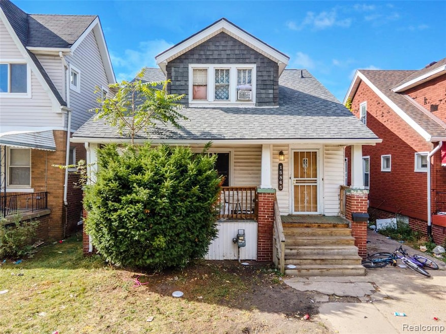 Duplex featuring roof with shingles and covered porch